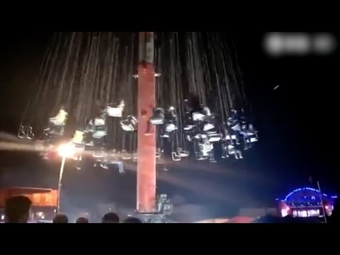 a fairground swing ride crashes to the ground