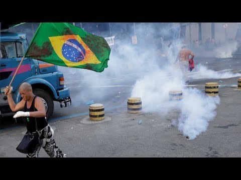 protesters clash with police as rio votes to release