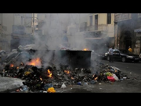 rubbish crisis forces residents to wear face masks in beirut