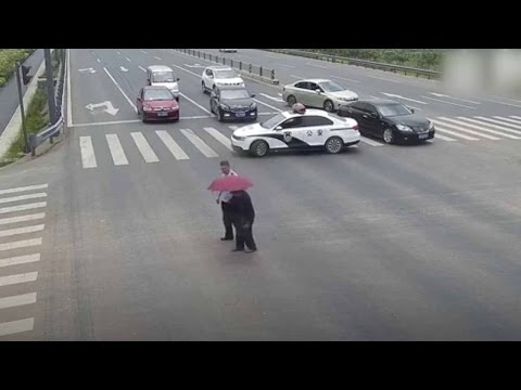 policeman stop traffic with car to guide