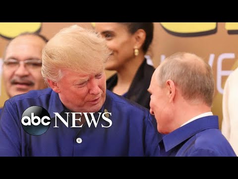 trump travels to vietnam and shakes hands