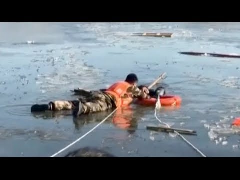 firefighters rescue man stranded in icy lake in north china